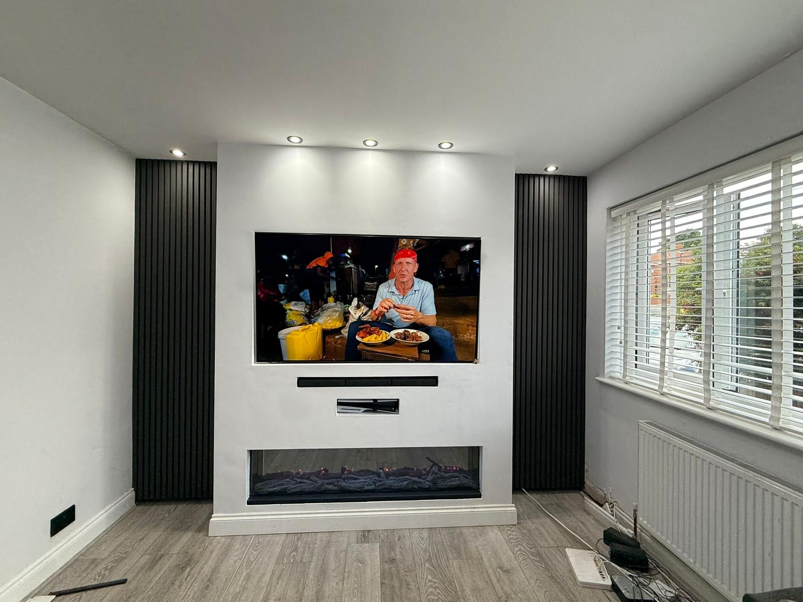 Media wall with TV, soundbar and electric fire