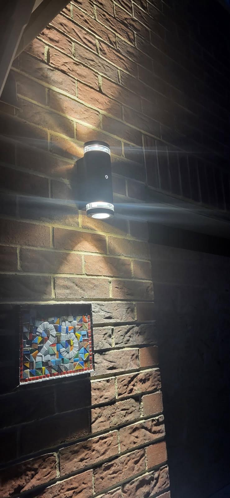 Outdoor up-down wall light on brick